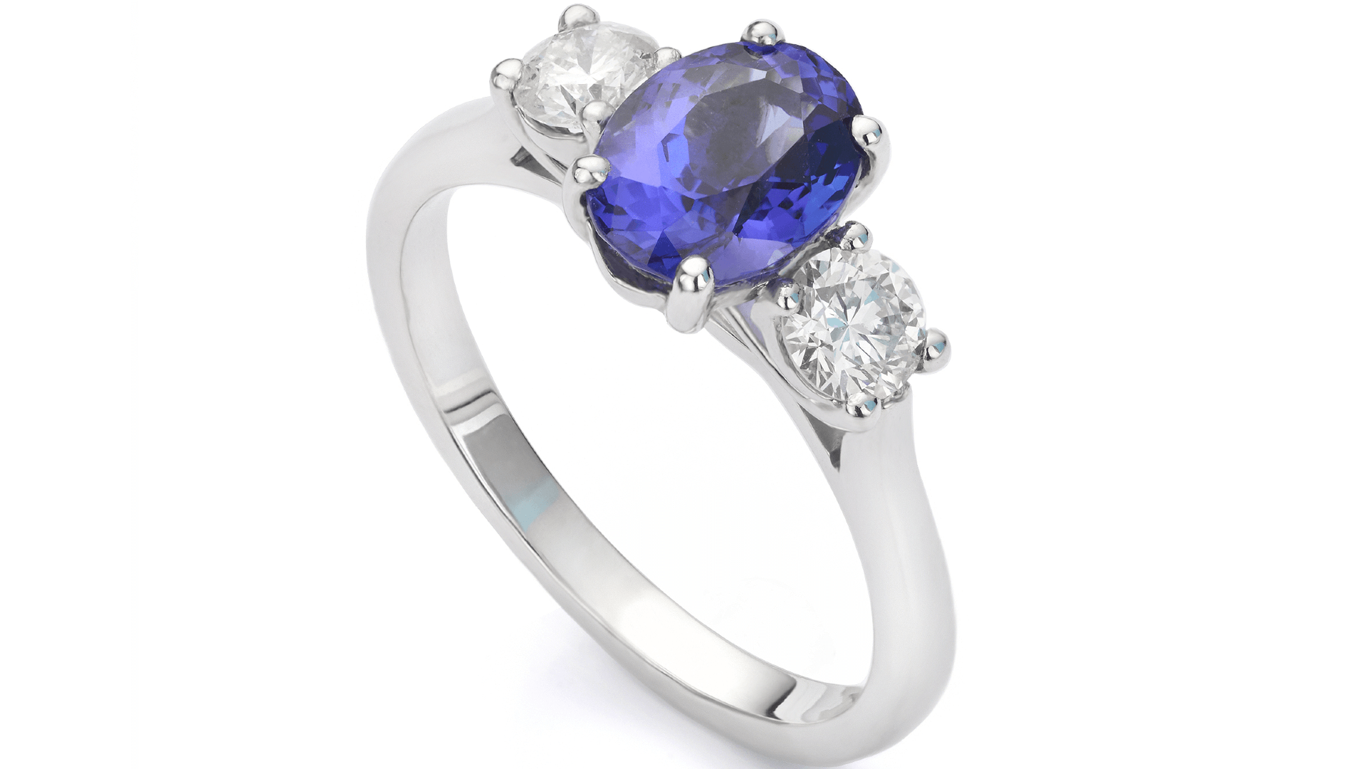 a ring studded with a blue sapphire and two diamonds