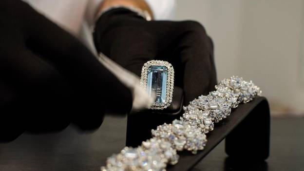 a person is cleaning an emerald